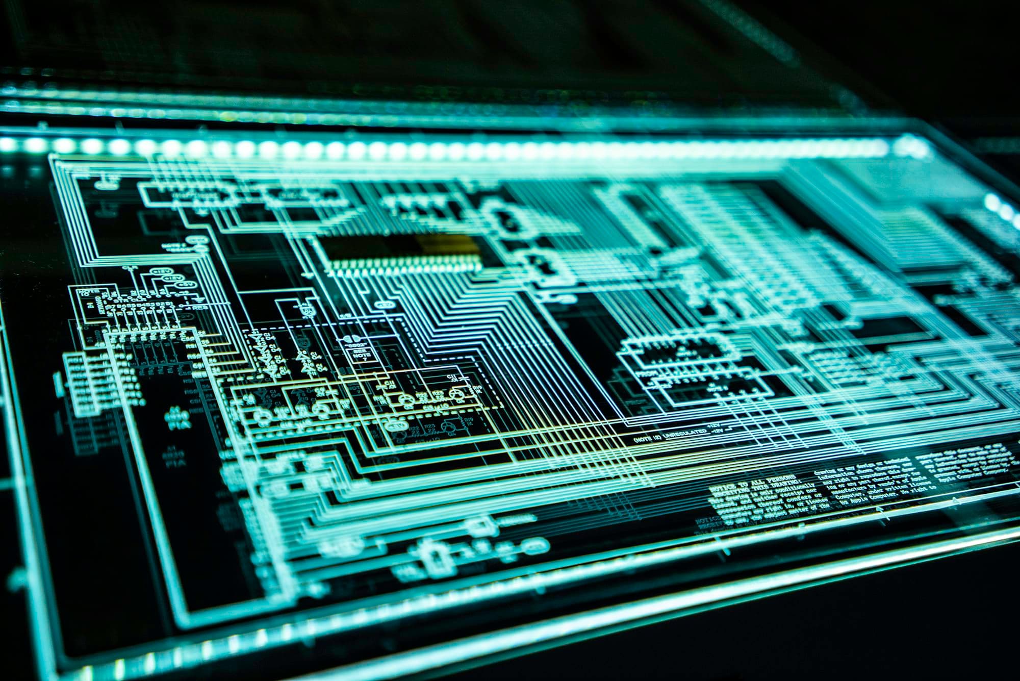 Glowing circuit lines on a dark surface